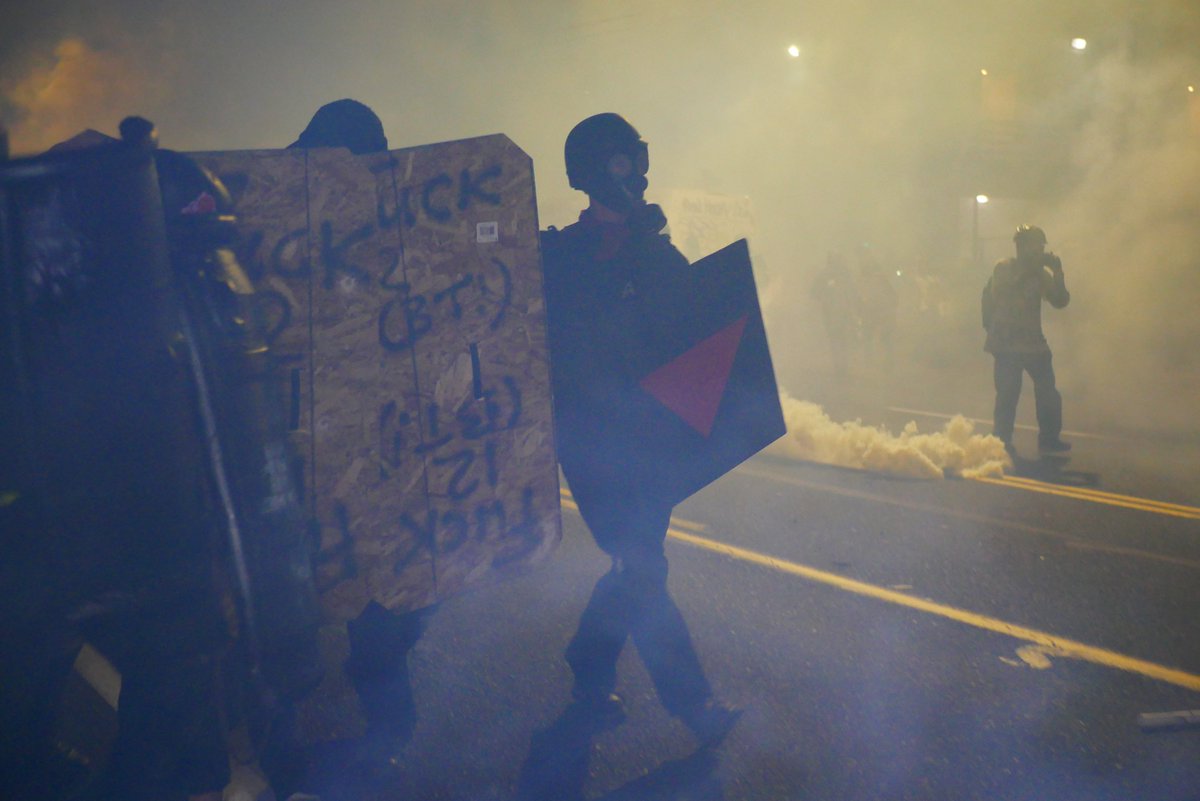 9/5 2121-2122 The shield wall retreats as  #PPB and  #OSB advance, more gas or smoke is fired as officers approach.  #pdxprotest  #BLM  #portland  #blacklivesmatter    #portlandprotest  #defendpdx  #BLMprotestsvideo:  https://twitter.com/BaghdadBrian/status/1302518181899063296