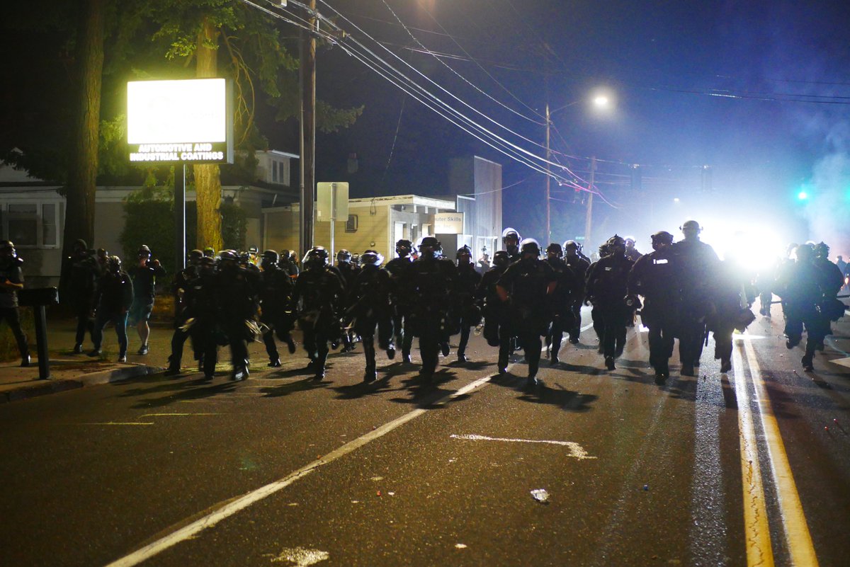 9/5 2136-2137 Officers run toward the crowd as a small group of protesters straggles behind the rest. Police then regroup at the intersection of 117th and Stark (I believe) #pdxprotest  #BLM  #portland  #blacklivesmatter    #portlandprotest  #defendpdx  #BLMprotests