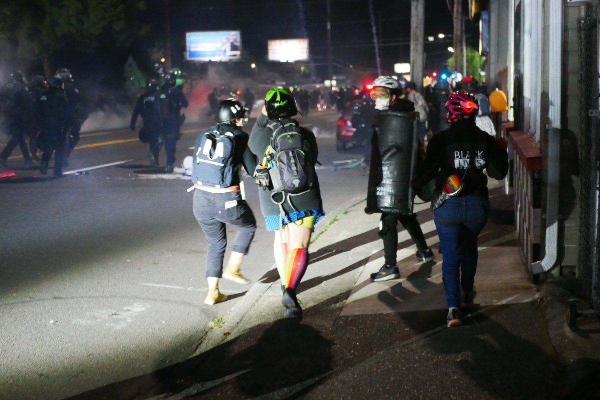 9/5 2136-2137 Officers run toward the crowd as a small group of protesters straggles behind the rest. Police then regroup at the intersection of 117th and Stark (I believe) #pdxprotest  #BLM  #portland  #blacklivesmatter    #portlandprotest  #defendpdx  #BLMprotests