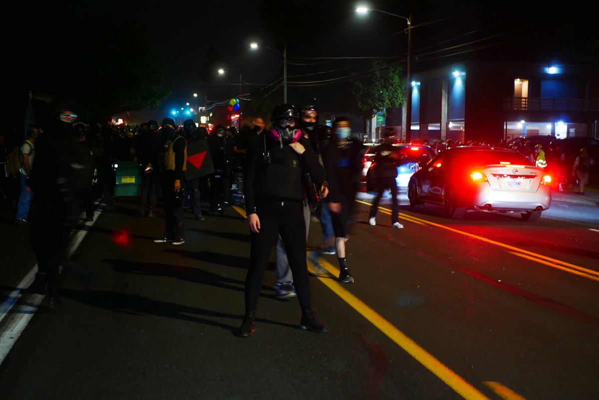 9/5 2245-2246  https://twitter.com/BaghdadBrian/status/1302500629848313856After their own intermission, protesters regroup on Stark near Ventura Park. Dumpster is placed in the street. Protester texts while waiting for  #PPB  #OSP  #pdxprotest  #BLM  #portland  #blacklivesmatter    #portlandprotest  #defendpdx  #BLMprotests