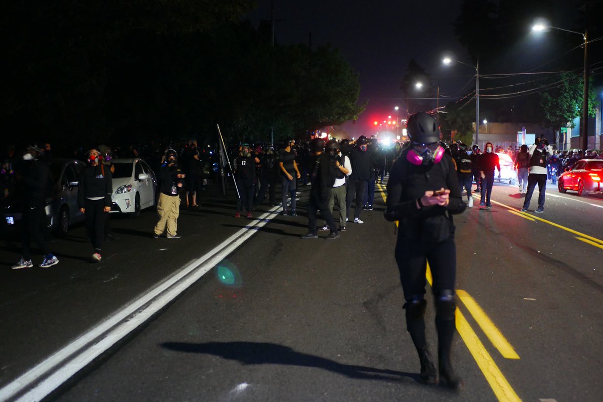 9/5 2245-2246  https://twitter.com/BaghdadBrian/status/1302500629848313856After their own intermission, protesters regroup on Stark near Ventura Park. Dumpster is placed in the street. Protester texts while waiting for  #PPB  #OSP  #pdxprotest  #BLM  #portland  #blacklivesmatter    #portlandprotest  #defendpdx  #BLMprotests