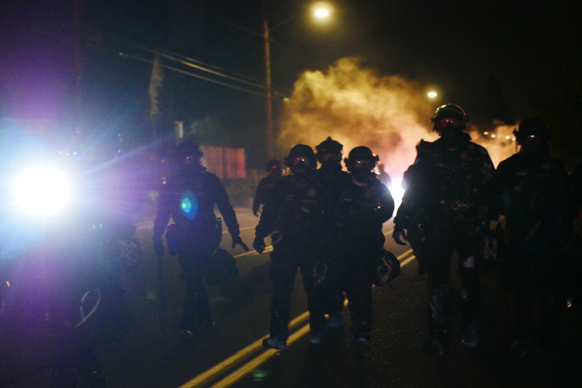 9/5 2249-2250 An officer lobs a gas or smoke canister at this reporter. After this officers continue to advance toward the burning barricades.  #pdxprotest  #BLM  #portland  #blacklivesmatter    #portlandprotest  #defendpdx  #BLMprotestsvideo:  https://twitter.com/BaghdadBrian/status/1302502117312139271