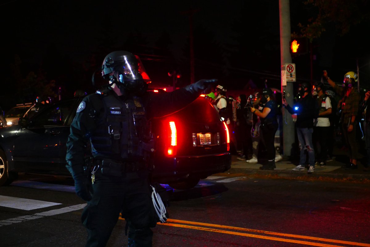 9/5 2252-2256 Police secure the area, officer 31 scans the press looking for protesters, one officer aims an impact munition rifle at the crowd.  #pdxprotest  #BLM  #portland  #blacklivesmatter    #portlandprotest  #defendpdx  #BLMprotests