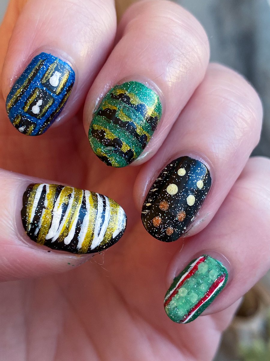 vexedmuddler's tweet photo. So @holotaco is having a cat-themed nail art contest, but they didnโt specify *felines*, so here are my caterpillar nails for #holotacocatsnailart - who can name all 10 species? https://t.co/3qRWPKyMwV