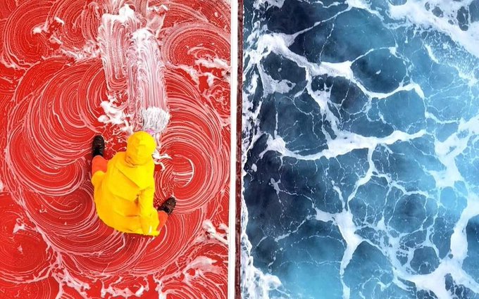 Rainmaker1973's tweet photo. A seafarer cleaning a ship red deck while a ship was sailing in the ocean. This was an aerial view of the ship red deck and whirling Blue Ocean as well as the life of a seafarer captured by photographer Zay Yar Lin https://t.co/tjv5NyJ9p8 https://t.co/EpnjWsnJ9b