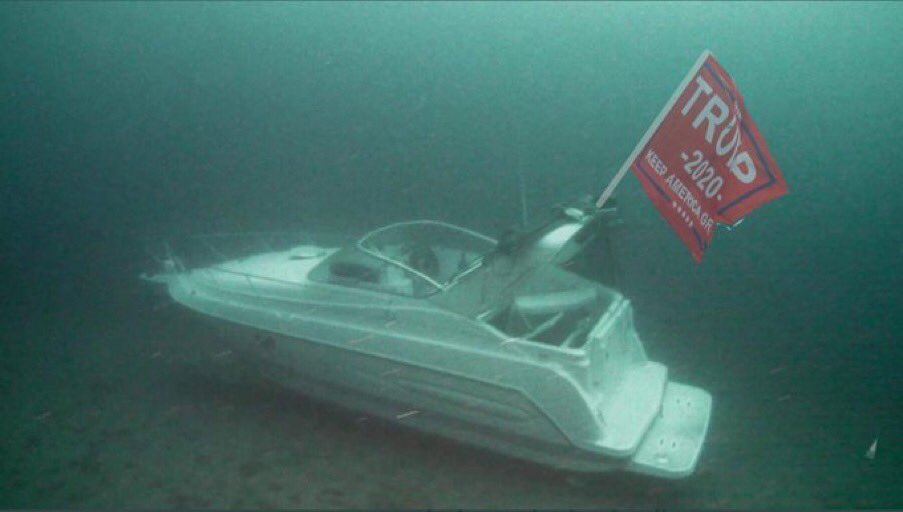 DeanWallaceCA's tweet photo. A fitting end to this vessel that sunk at #Dumbkirk — to round out the metaphor: it clings to that Trump MAGA flag, even after it’s already sunk to the bottom. https://t.co/gGP4GMQBgi