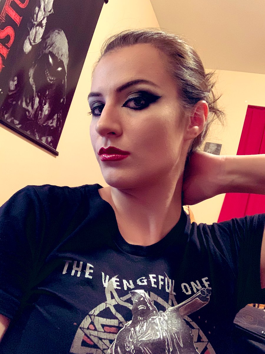 TheJasAlexander's tweet photo. Was feeling #FanFriday on Sunday.  Did my makeup to match my #TheVengefulOne shirt with a portrait of @DEVICETHEBAND and a poster of The Guy in the background and everything!  #DisturbedOne #DownwiththeSickness @Disturbed @DisturbedFP @DanDoneganGtr @MikeWengren @JohnMoyerBass https://t.co/sHzzKG2xmq