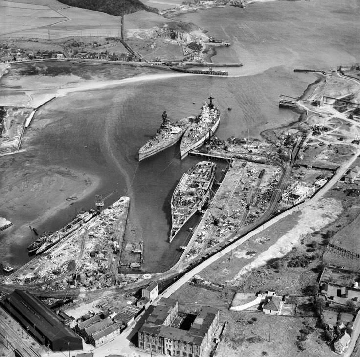 in Inverkeithing, Fife, Scotland, United Kingdom. The smoke from the burning sludge oil rises into the air from the broken hull of HMS Rodney, which had played a major role in the sinking of the German battleship Bismarck during World War 2. 