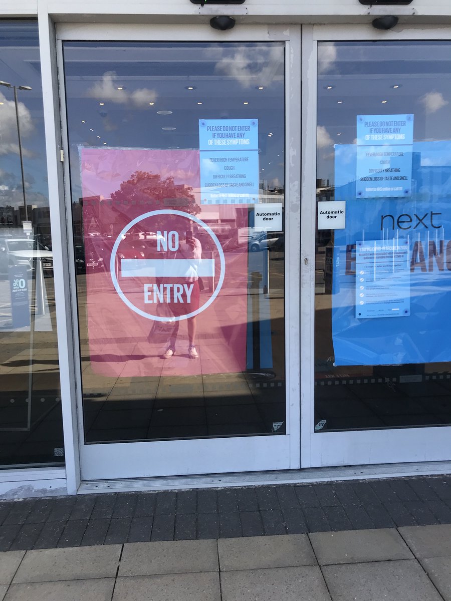 This giant no-entry sign on the doors at Next isn't quite the welcome you hope for from a store. I'm sure there's a clearer and less aggressive way to communicate COVID regulations to customers <a href="/nextofficial/">Next</a>