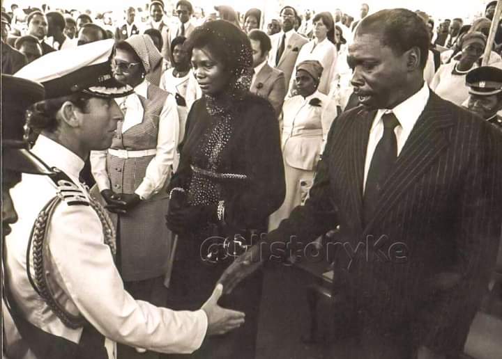 Mama Ngina looks on as Britain's Prince Charles greets acting President Daniel arap Moi moments before the body of Mzee Jomo Kenyatta was