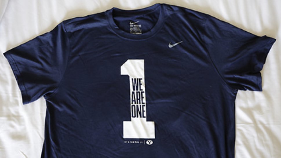 DailyUnivSports's tweet photo. BYU Football is wearing t-shirts with the messages “We Are One” and “Love One Another” to today’s Labor Day matchup against Navy on national television. https://t.co/X0i4amUwGA