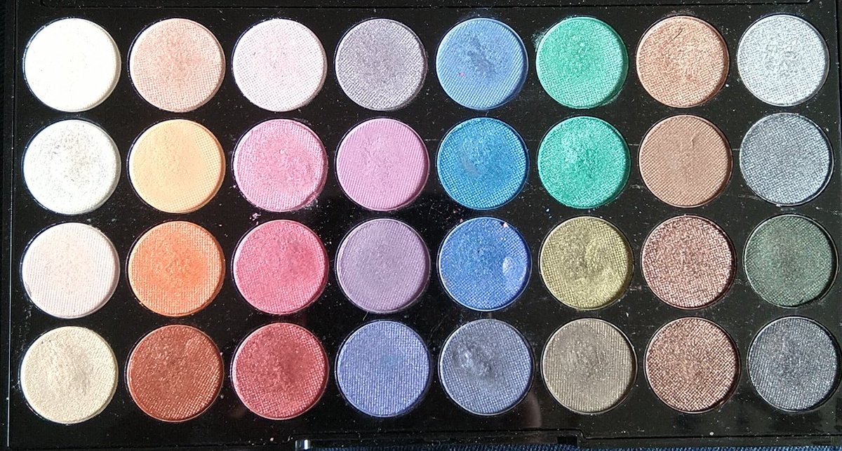 Revolution Mermaids Forever, the first palette I went out and bought for myself, amateur mistake: THEY'RE ALL SHIMMER. here have a really old cringey early day example