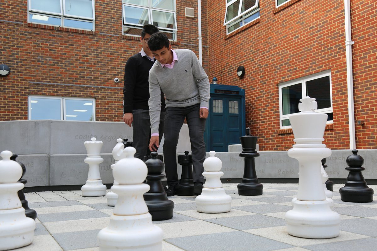 HamptonSchool's tweet photo. Checkmate! Some of our Sixth Formers enjoying a game of outside chess in the courtyard this afternoon ♟️👑 https://t.co/Yc8CbRK2Yv