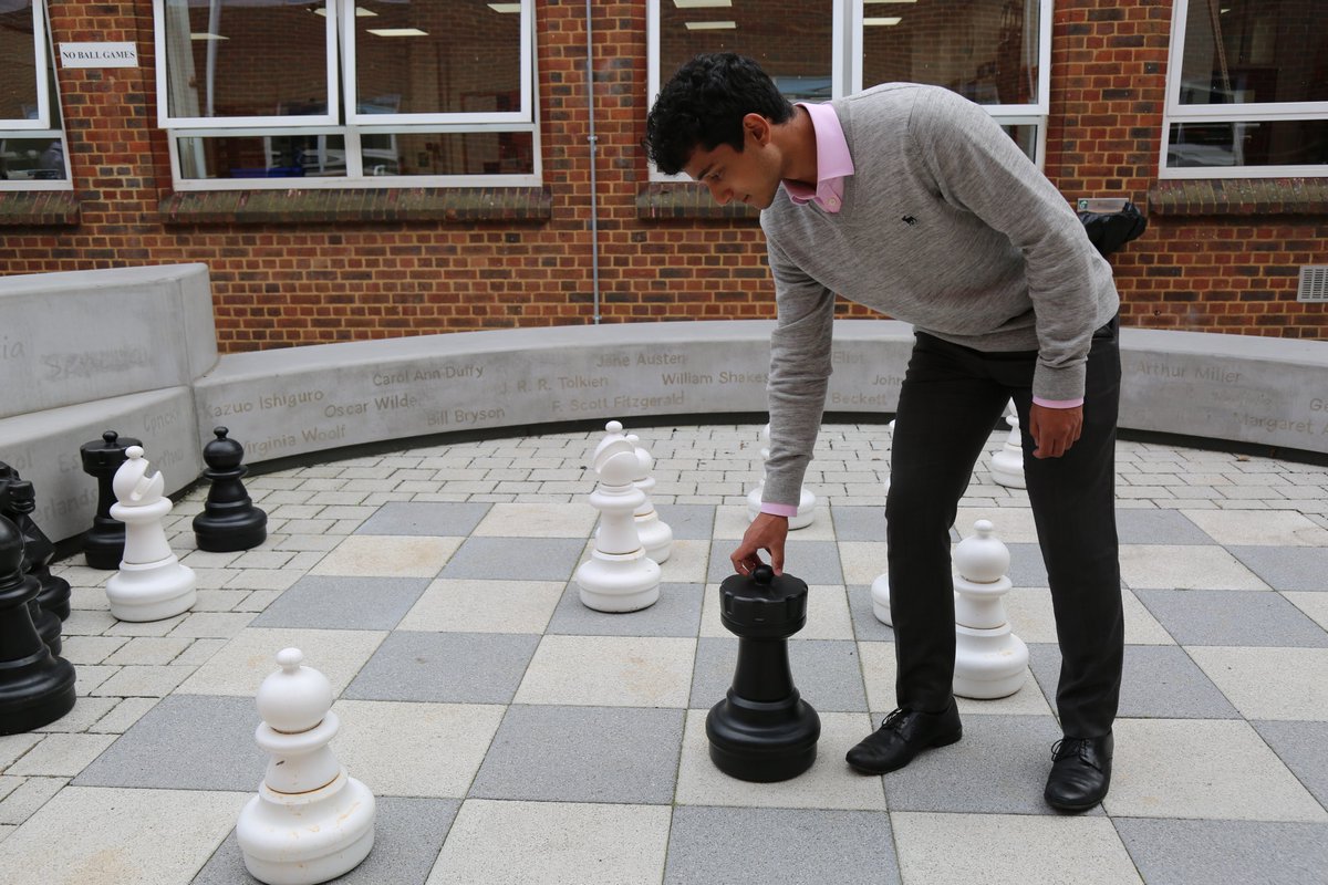 HamptonSchool's tweet photo. Checkmate! Some of our Sixth Formers enjoying a game of outside chess in the courtyard this afternoon ♟️👑 https://t.co/Yc8CbRK2Yv