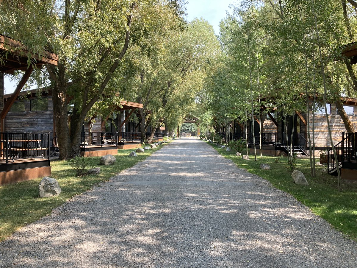 stillwell's tweet photo. Pretty development in Jackson Hole, WY. Really interesting use of the space &amp; zoning. This was a more standard RV park prior to adding these modular cabin units. These things rent ~$250/night! https://t.co/SJlH3PWczs