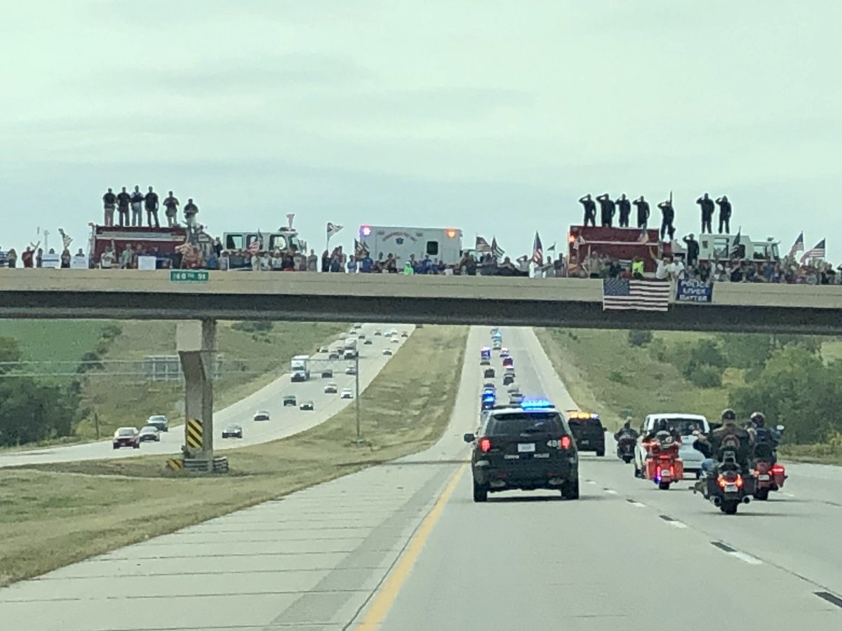 OPDOfcBossman's tweet photo. The show of support from thousands of people lining the procession route for @Lincoln_Police Officer Mario Herrera was incredible. It was an honor to help escort him back to Lincoln. #1205 https://t.co/MwxF1UAg8h