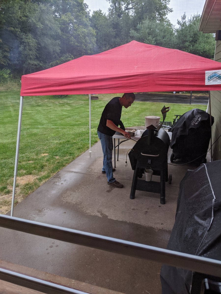 mpschemenauer's tweet photo. A little rain doesn't stop this guy from smoking. #LaborDayWeekend #Traeger #Smokingribs https://t.co/JJ5DgUjx32