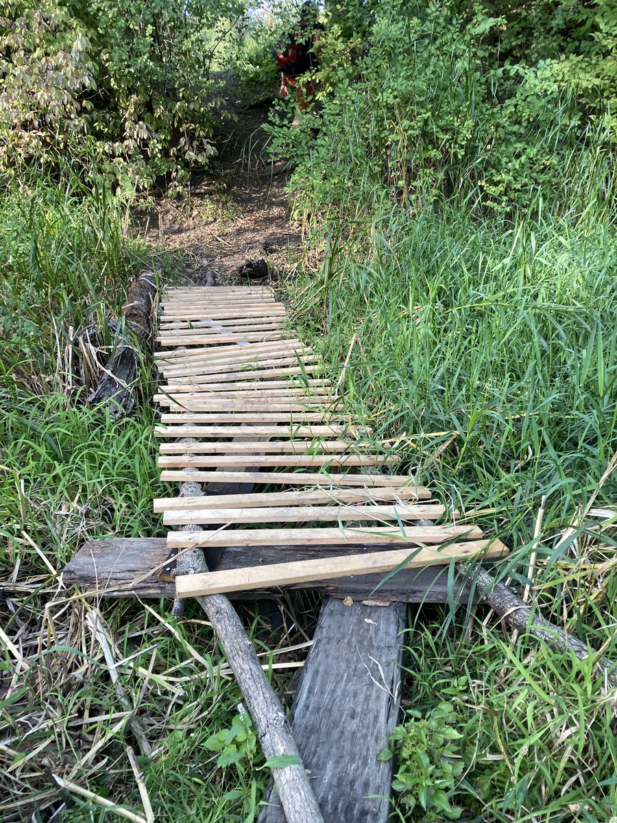 This wonderful upcycled walkway over a boggy crossing totally counts as a repair—it’s laid atop the older, more treacherous zig-zag plank crossing.