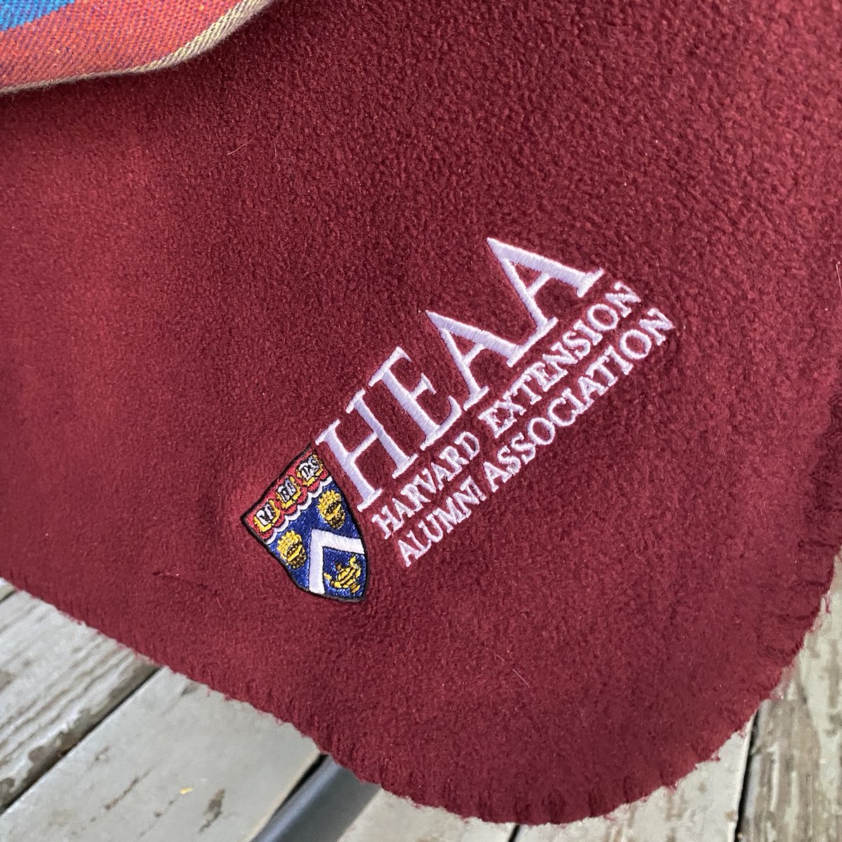 harvardextended's tweet photo. My trusty @HarvardExtAlum blanket. Can't recall if I got it when I graduated or donated, but regardless it is a nice thing to have outside on the porch on a cool fall evening. #HarvardExt https://t.co/slCvGO7N90