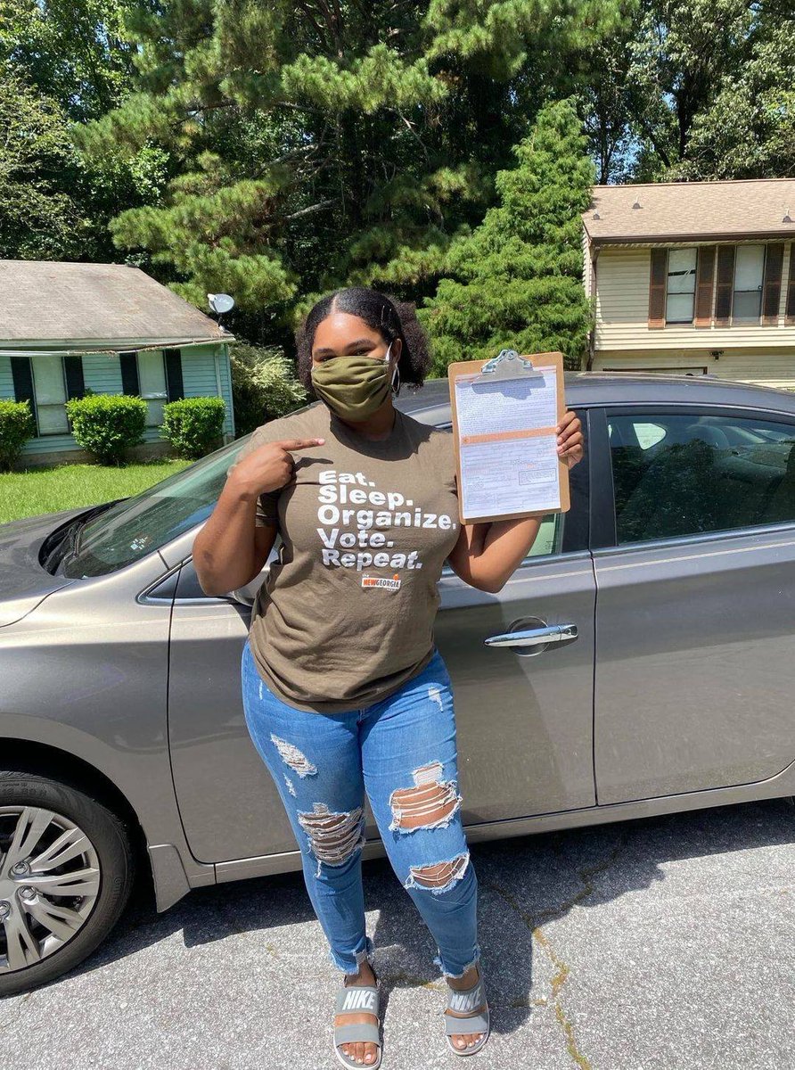 This is Maggie, one of the #NewGeorgiaProject  canvassers registering voters, wearing a mask sent by #LiftEveryVote's Masks for Democracy project! The #AuntieSewingSquad sewed 300+ of the masks! @Joyce_Hackett @voicewhiz @mskristinawong