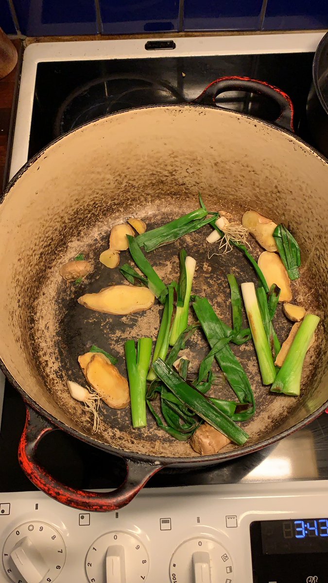Anyhoo, I’m going to make a kind of cheat’s tonkotsu stock today (cheating because I have no pigs feet which yes, is very wrong.)Starting off by burning some spring onions and ginger in a dry pan.