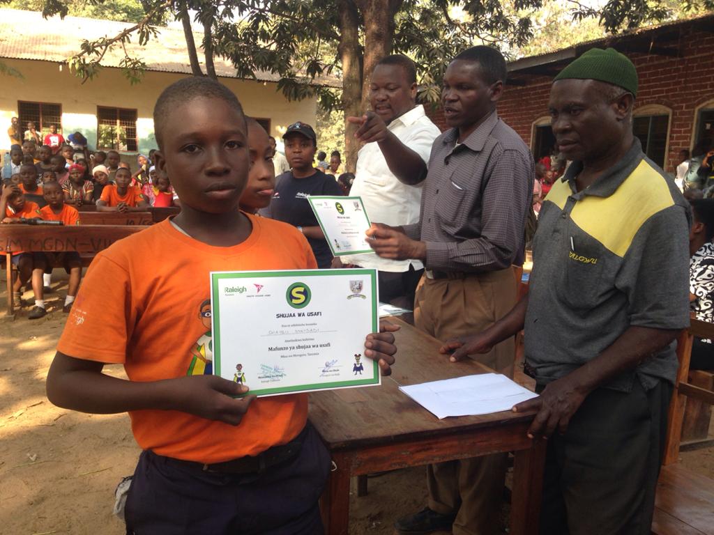 RaleighTanzania's tweet photo. Ealier last week, 20 students from Mgudeni primary school graduated from healthier lives, happier homes training on WASH as SWASH HEROES . Now they are ready and competent. They will cascade that education to their society as SWASH heroes. #healthlives #happierhomes #wash https://t.co/pgFgXeexAV