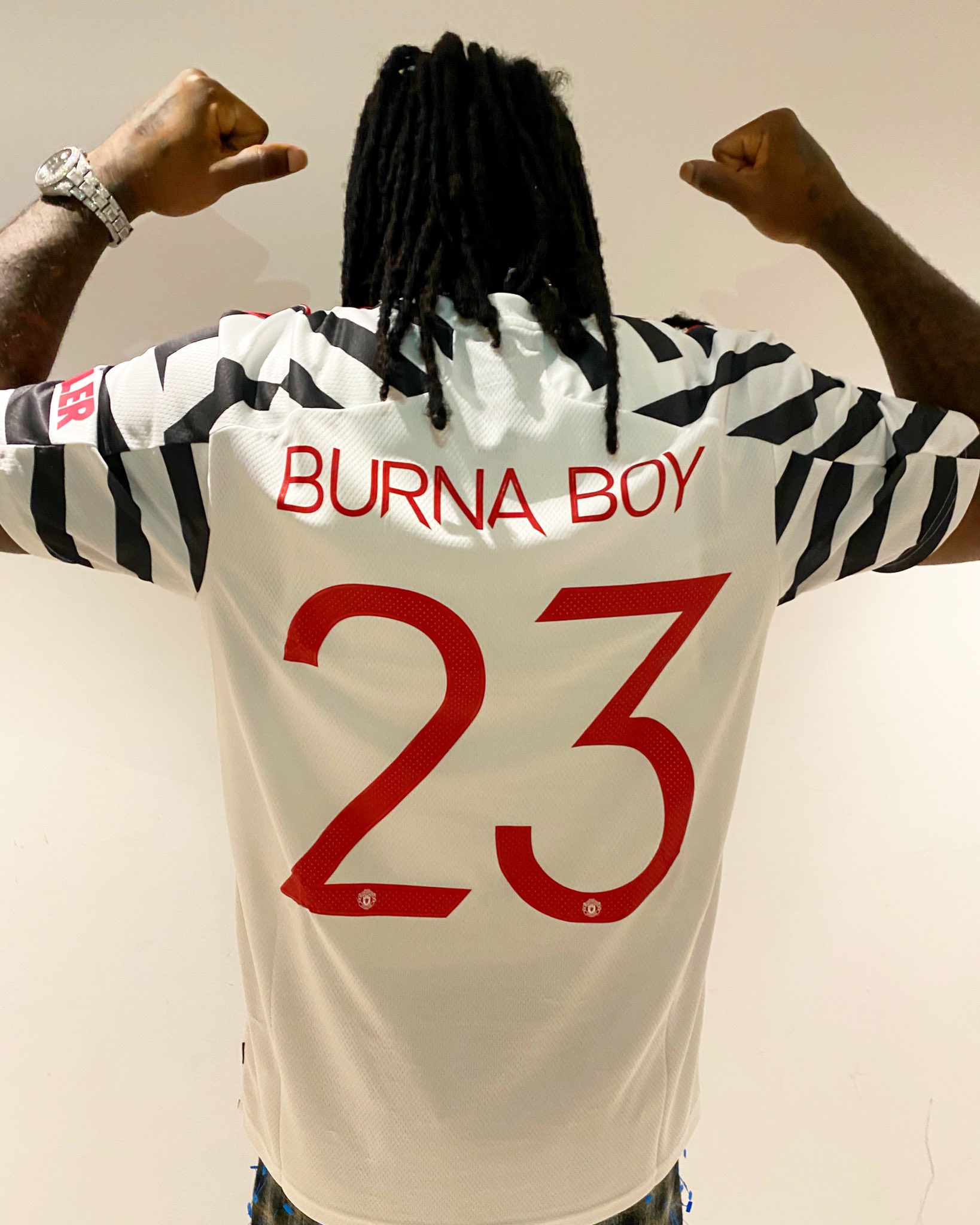 Burna Boy shows off Manchester United new jersey