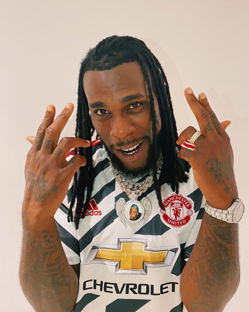 utdreport's tweet photo. Nigerian artist Burna Boy repping the new third kit 🇳🇬 https://t.co/h8BnWSCPsu