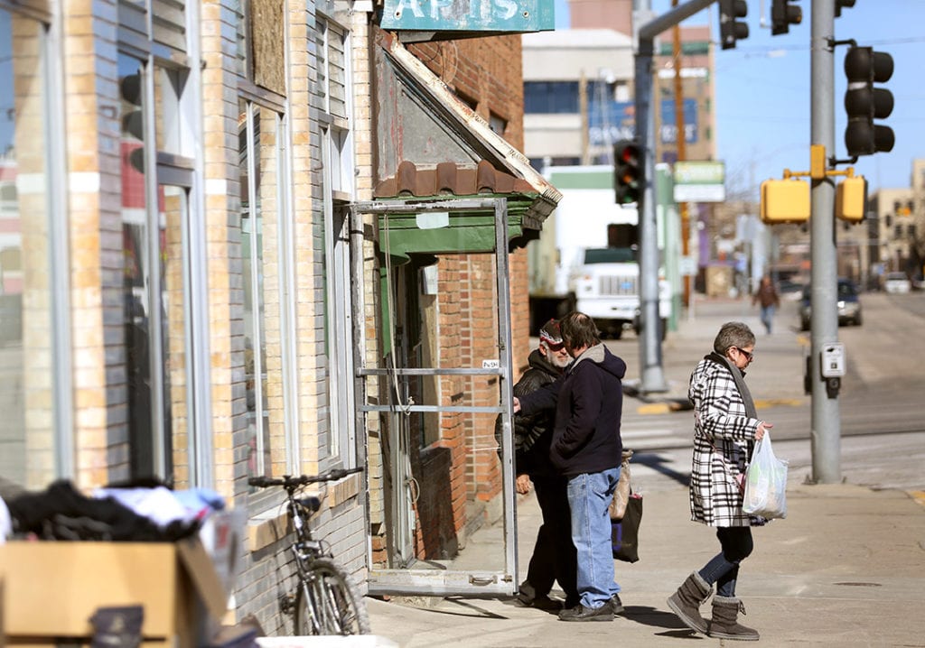 People gather at entrance of Poverty Resistance Food Pantry on 450 South Wolcott in Casper, Wyoming, US.