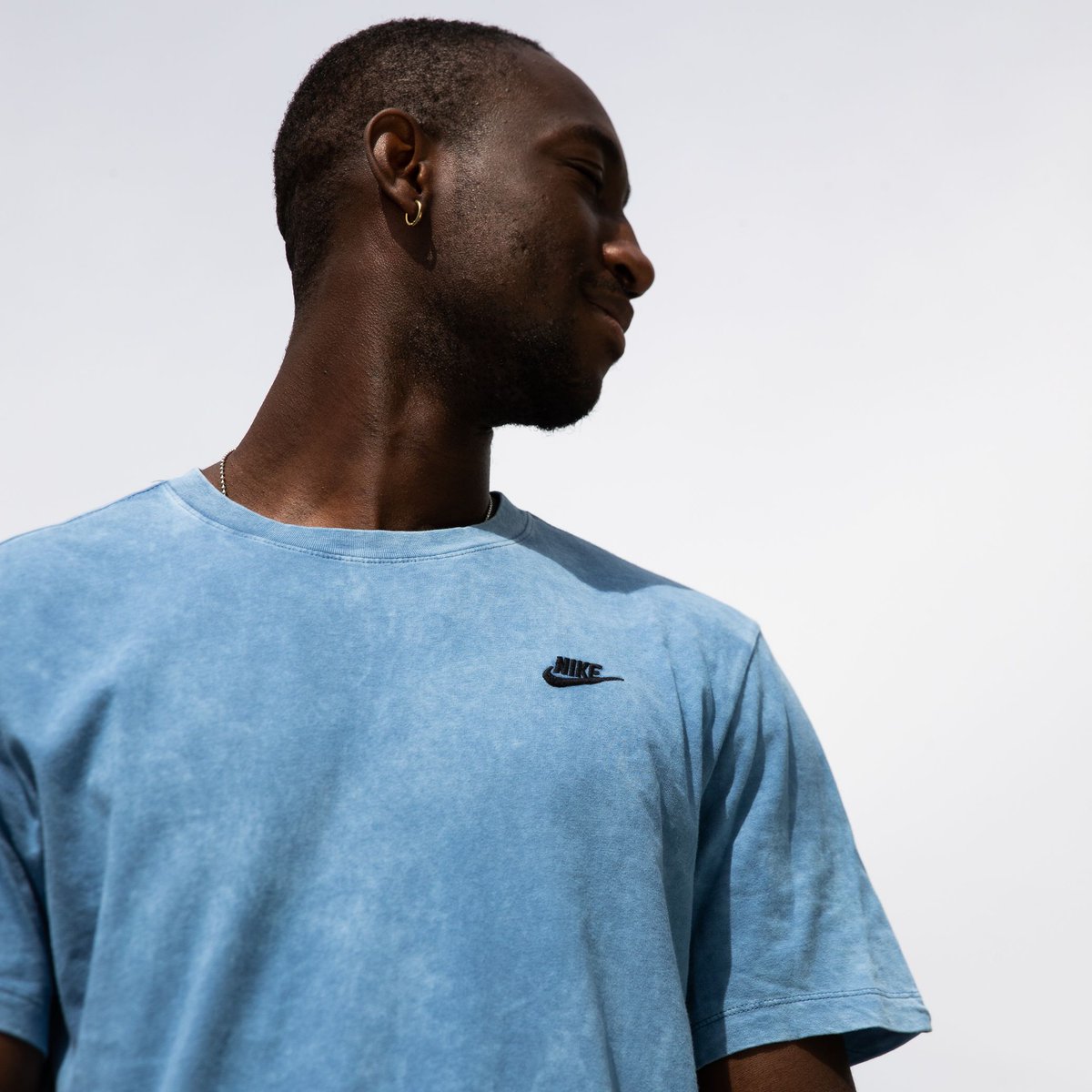stone blue nike shirt