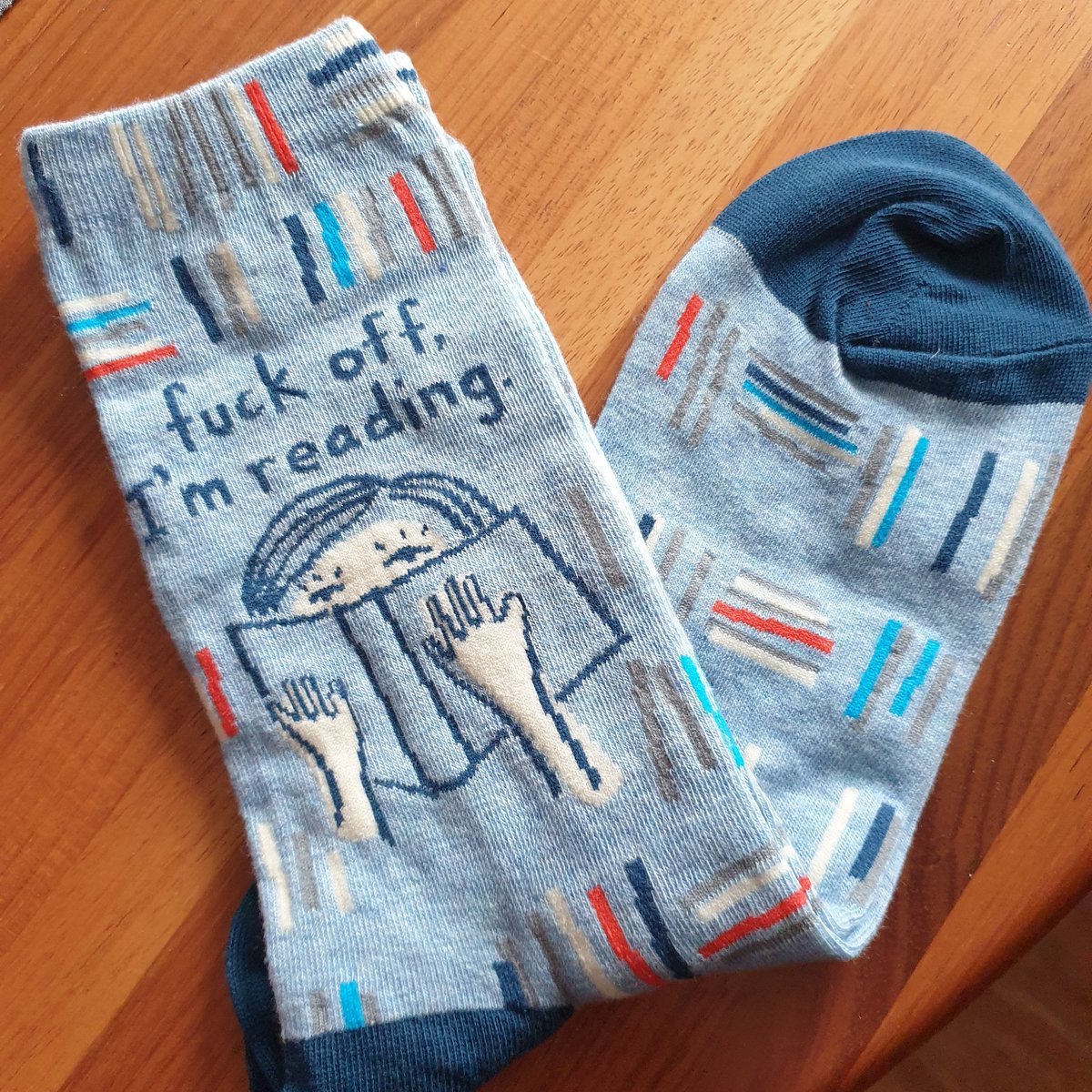 JaneErikaBrady's tweet image. My sister bought me the most perfect pair of socks. 

#fuckoffimreading