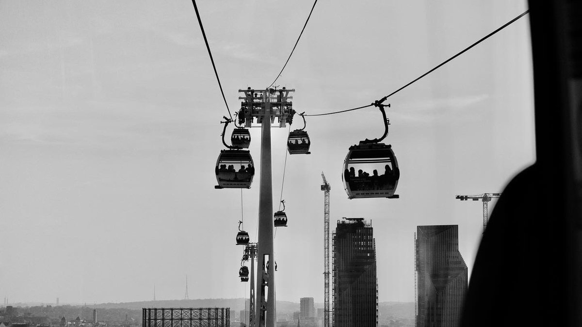 russgoffewood's tweet photo. Riding the cable cars in London. Quick and expensive but the kids like it. 
#bnwphotography #londonphotos https://t.co/w08xwrSwMi