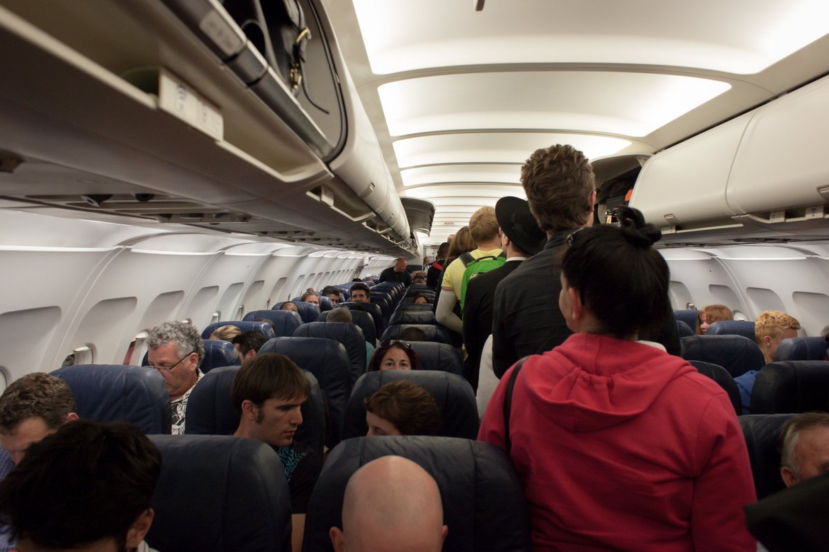 OnHealer's tweet photo. The airplane was stuck on the tarmac in Chicago. 
Anxiety rippled across the passengers who would miss flights. 
Who takes action? Check our latest podcast episode with @SaulWeiner @StefanKertesz @JHUPress https://t.co/JJTNgWKSg6 https://t.co/XRyfUKjNsi