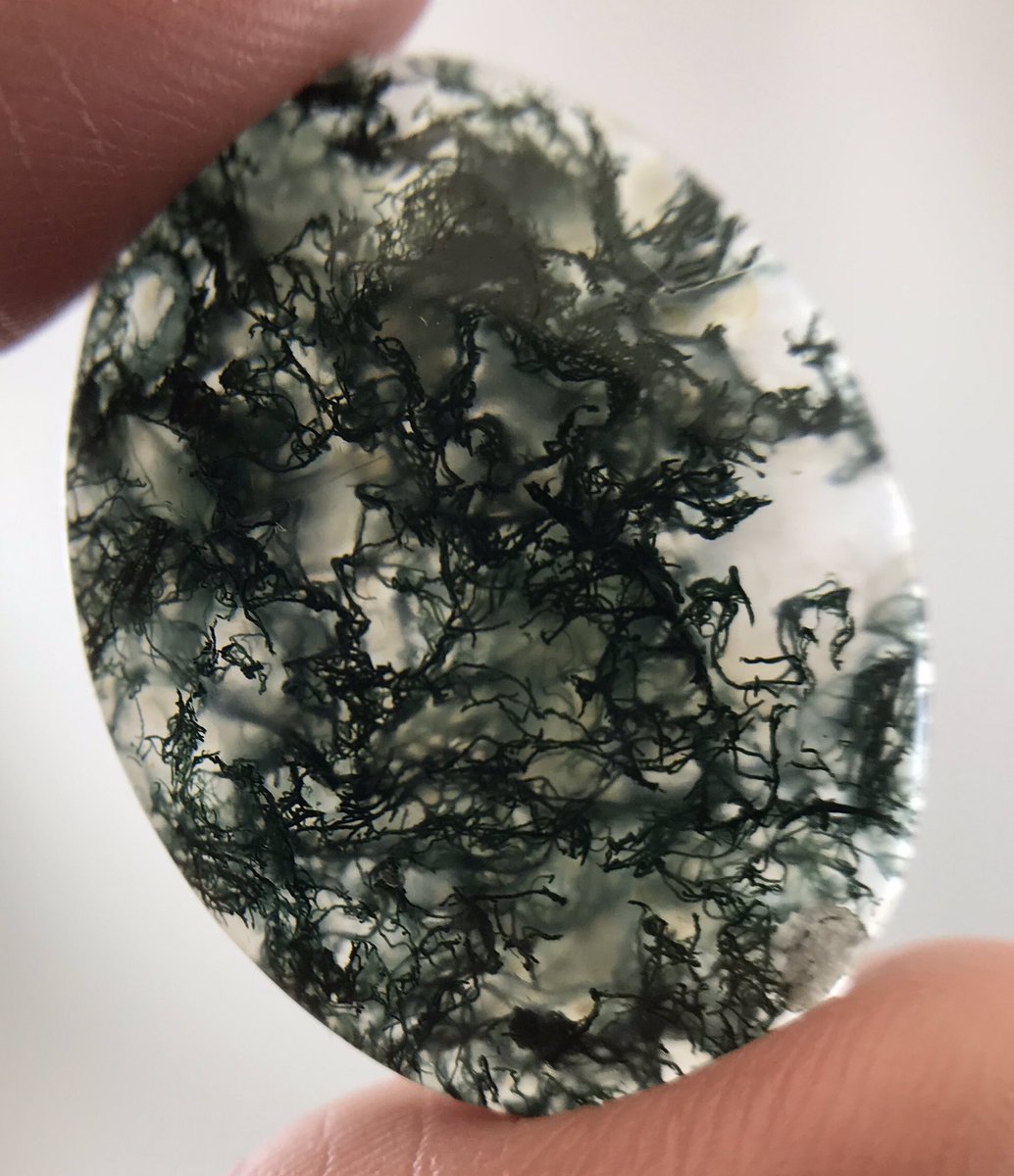PS: Here's a better pic of the last one since a few people suggested it might be moss agate. I'm pretty sure it's fibers in glass to make it look like moss agate, it's kinda clever.