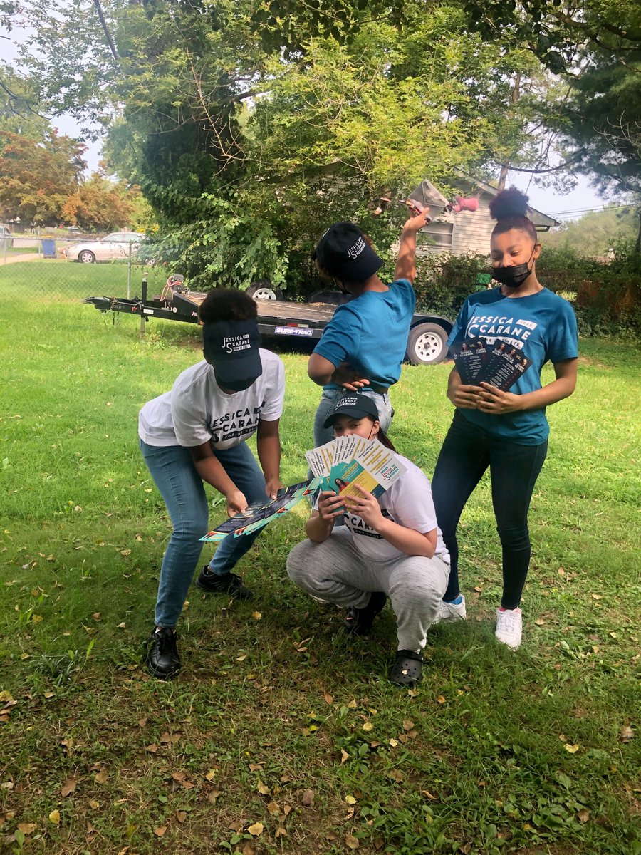 4 #TeamJess volunteers posing in a front yard.