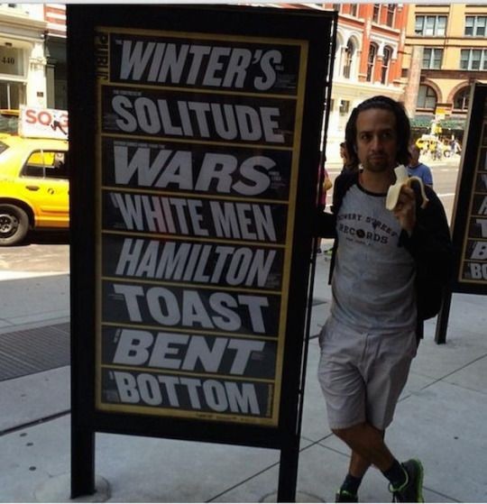 LMMthings_'s tweet image. Lin eating a banana next to a sign