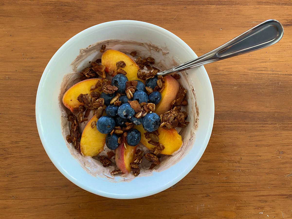 Lunch: Chocolate protein yogurt with peaches, blueberries and cinnamon nutmeg granola!