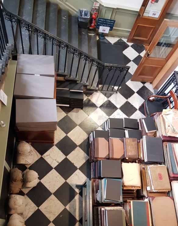 TrinCollLibCam's tweet photo. First day back working in the #WrenLibrary, and it really looked as if, in the absence of tourists and readers, the original inhabitants of the library had conquered some extra space for themselves. It's The Big Books Takeover! 😉📚 📚 📚 #librarianslife #bookmove #sonicetobeback https://t.co/Sxcd4AGfPe