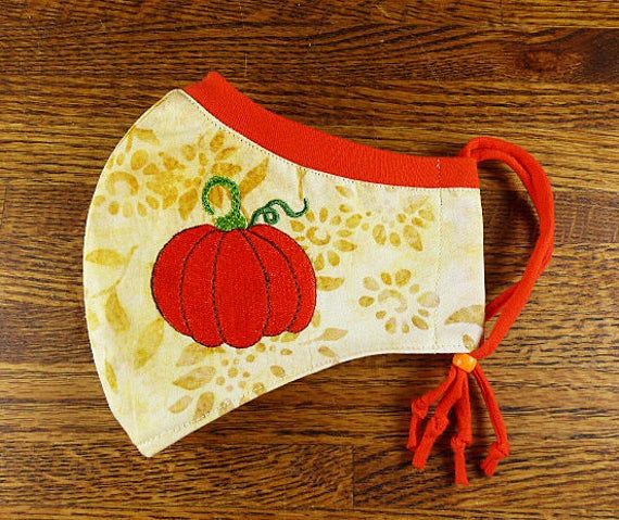 SantaFeKiss's tweet photo. Pumpkin Embroidered on Washable, 3 layer face mask w Stretchy nose band to help eliminate fogging of glasses w Filter pocket / Handcrafted in the USA #fallfacemask #pumpkinfacemask https://t.co/Lc8q3c37B3 via @Etsy https://t.co/uOAxWPiZP4