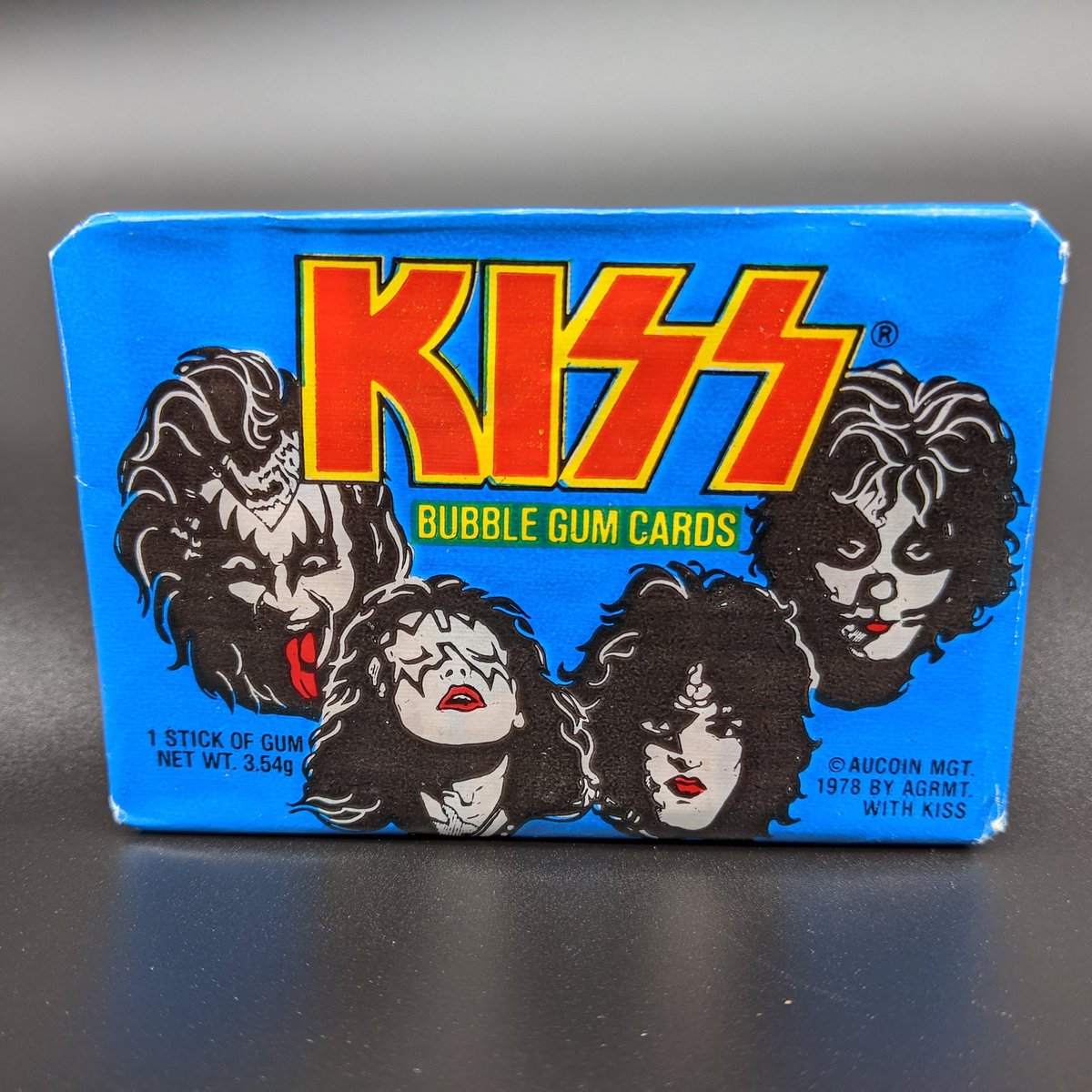 VIPmusicbiz's tweet photo. KISS Donruss 1978 Trading cards. Unopened pack of series 1 cards. Includes stick of bubblegum and cards. There are 66 cards in series 1.
#kiss
#kissonline 
#kisscollection 
#Aucoin
#musicmemorabilia
https://t.co/PorBtFs7uP https://t.co/YOJpi8erp2