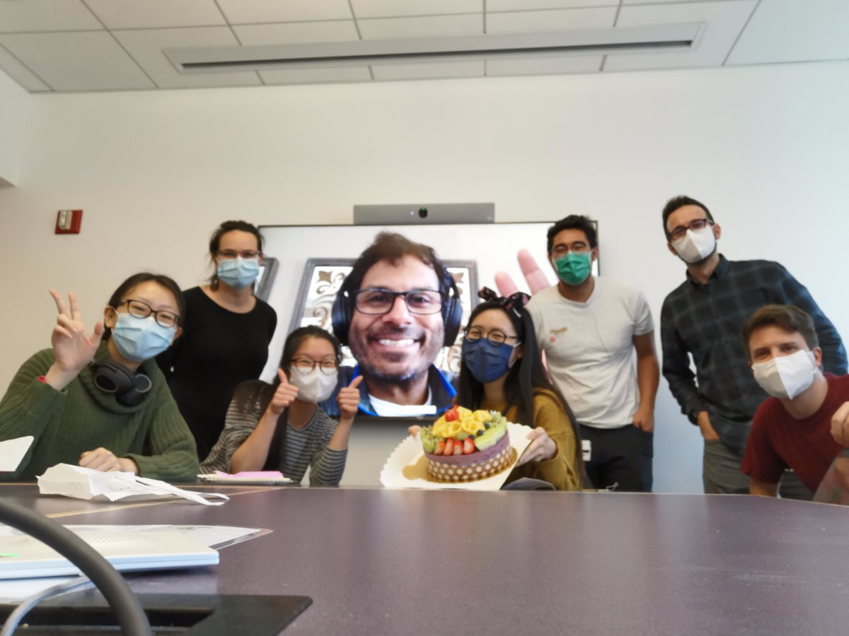 Dr. Koliwad's lab celebrating birthdays with a combo of face masks and giant Zoom screens!