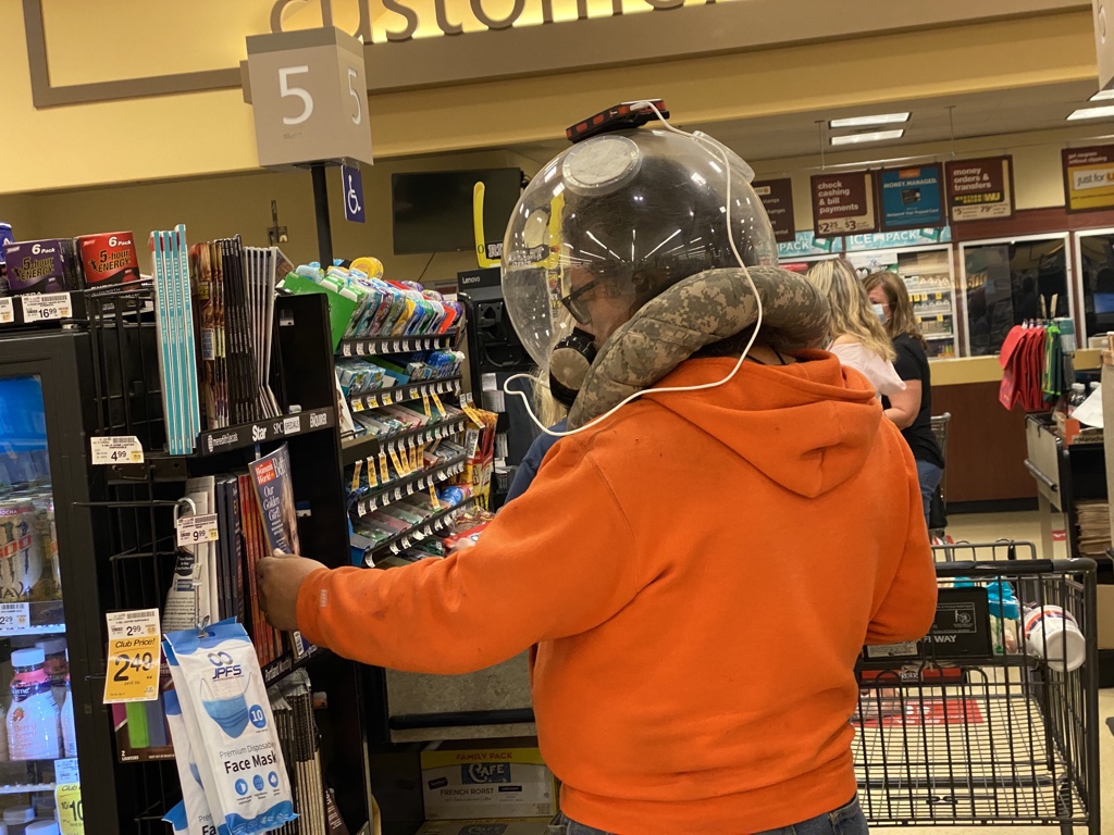 Vonster's tweet photo. Dude infront of me at grocery store created a retro looking space helmet with a mobile phone attached to play music. LOL https://t.co/tSNtALcmGD