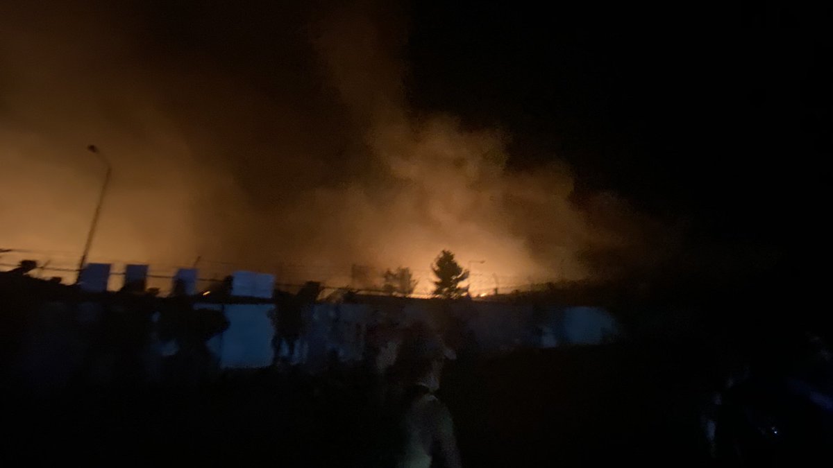 There is many people on top of the hill staying safe and moving farther as long the fire is getting closer