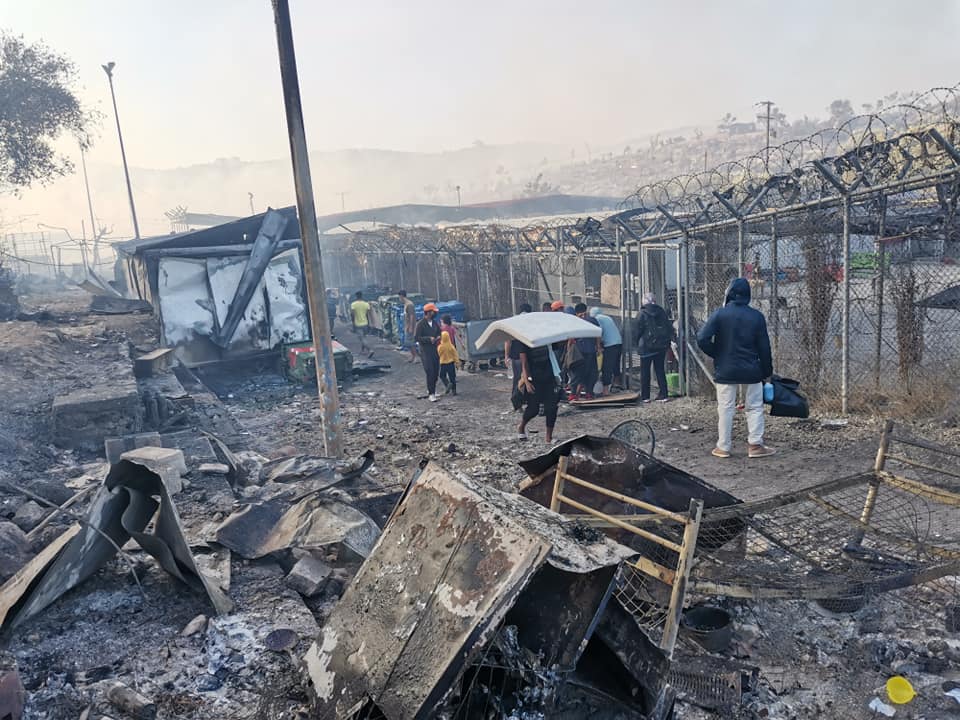 #Moria this morning: "Zone 12 completely gone, Zone 6 heavily damaged. Several parts of Central camp gone. About 35-40% total destruction. One of the fires blossomed up again, so now firefighters are back at work." Information and Photo by <a href="/standbymelesvos/">Stand by Me Lesvos</a>