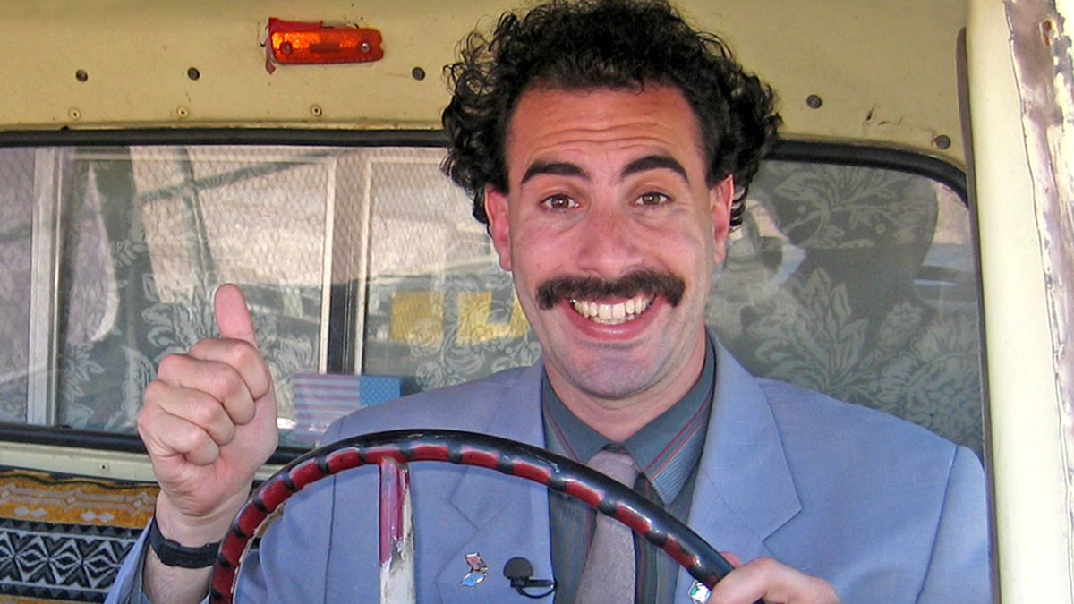 Complex's tweet photo. It’s official: ‘Borat 2’ has already been shot and screened by Sacha Baron Cohen. 👀

Details: https://t.co/RIdDaVEa1B https://t.co/fMpc5DCei6
