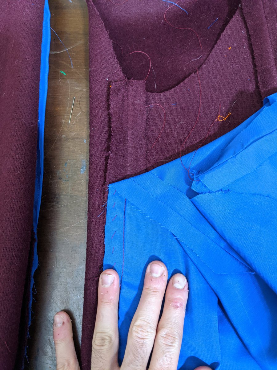 Weird step I've never done before, you lay the sleeve on top of the lining, both wrong sides out, and stitch the seam allowances together to keep the lining in place, then pull it all through the lining (I nearly did it backwards)