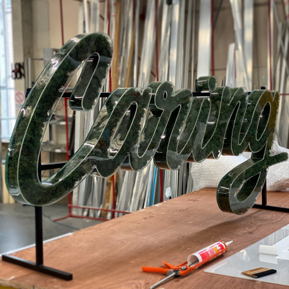 GoodwinDesign's tweet photo. #Moss encased in clear acrylic for outdoor use in a awesome script font. All hand crafted in our London workshop. #signswithsoul https://t.co/IIvk2ExmSj