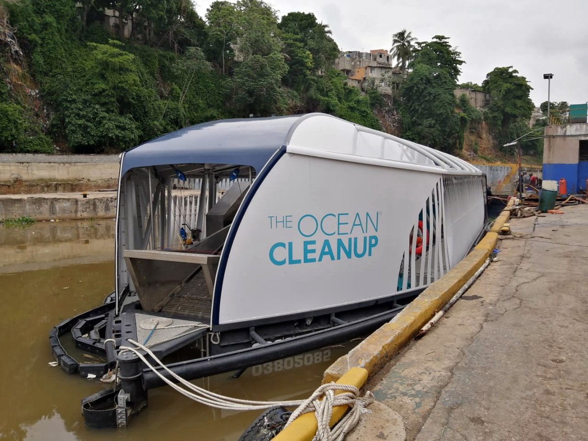 TheOceanCleanup's tweet photo. Interceptor 004 is temporarily docked due to damage incurred by excessive hyacinth buildup from recent tropical storms in the Dominican Republic. The barrier’s weak link disengaged and the anchor lines are damaged. With local partners, we are assessing what repairs are needed. https://t.co/rZLD1eJpMY