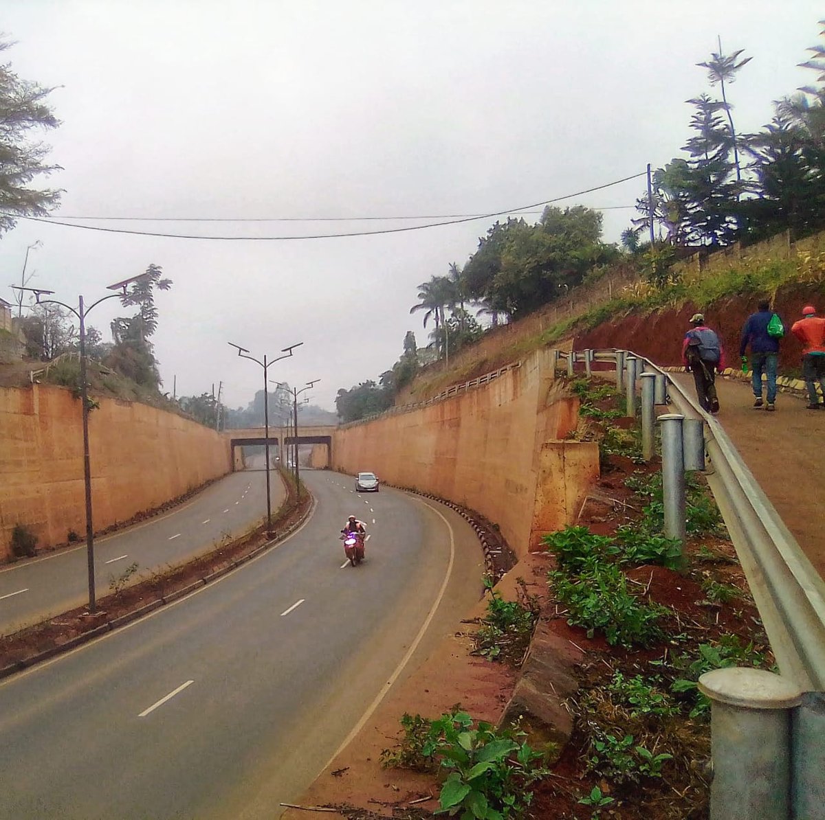 Right now, a bit further down the road, the ground behind this retaining wall has begun sinking. (Also, why did the project waste money on motor vehicle grade crash barriers for the walking/bike lanes?)