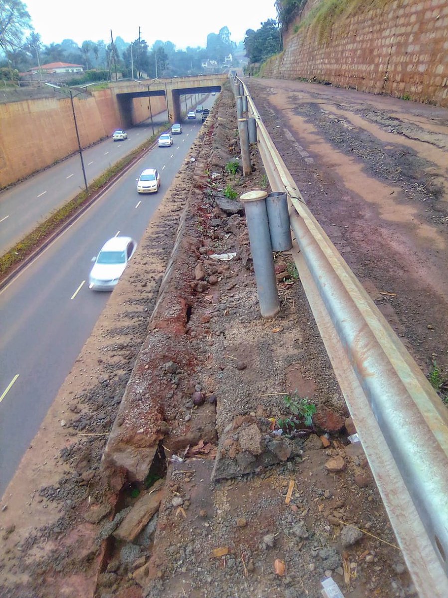 Right now, a bit further down the road, the ground behind this retaining wall has begun sinking. (Also, why did the project waste money on motor vehicle grade crash barriers for the walking/bike lanes?)
